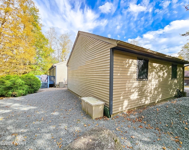 view of property exterior with central AC