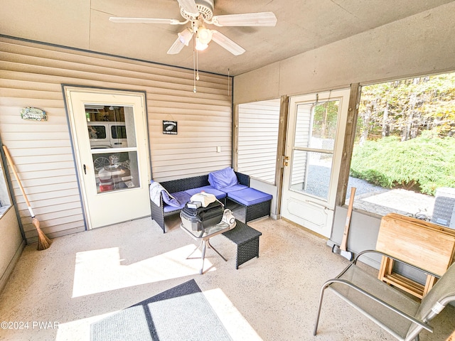 sunroom featuring ceiling fan