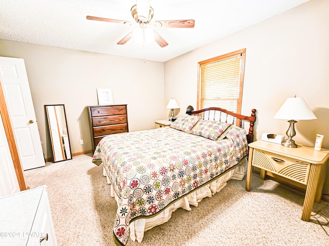 bedroom featuring ceiling fan and light colored carpet