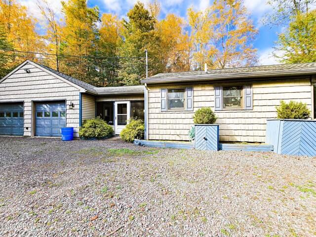 ranch-style house featuring a garage