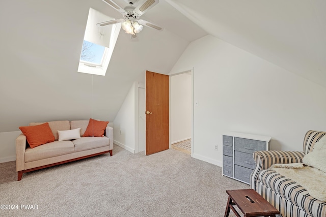 living area with ceiling fan, lofted ceiling, and light carpet