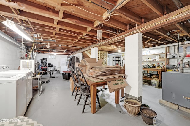 basement with a workshop area and washer and dryer