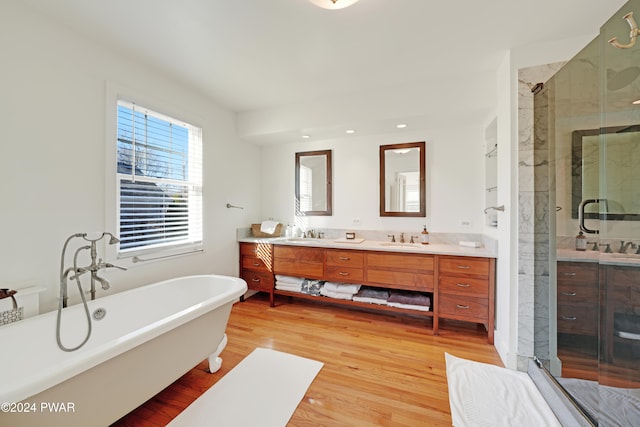 bathroom with vanity, separate shower and tub, and wood-type flooring