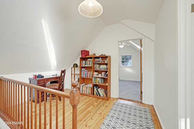 interior space featuring hardwood / wood-style floors and lofted ceiling