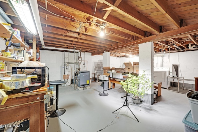 basement featuring washer / dryer and water heater