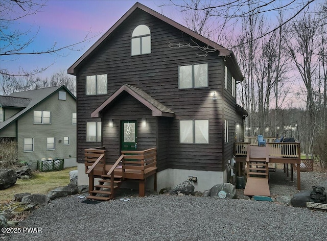 chalet / cabin featuring a wooden deck