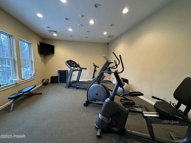 exercise area featuring visible vents, baseboards, and recessed lighting