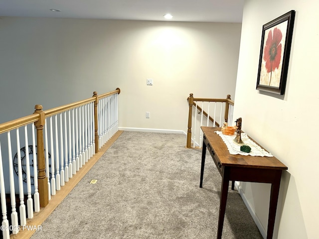 hallway featuring recessed lighting, carpet flooring, an upstairs landing, and baseboards