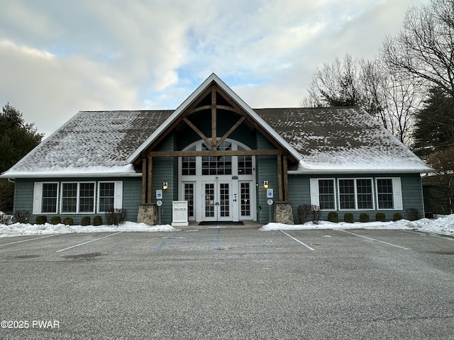 view of building exterior with uncovered parking