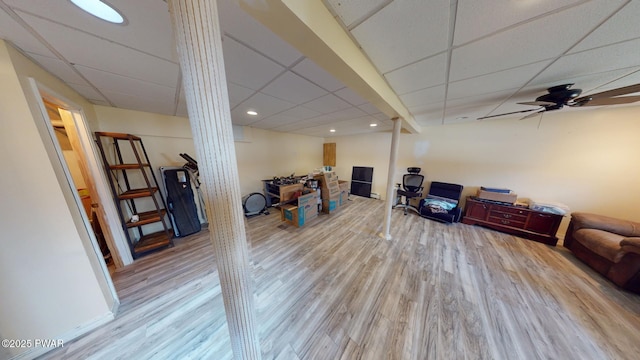 interior space with hardwood / wood-style flooring, a paneled ceiling, and ceiling fan