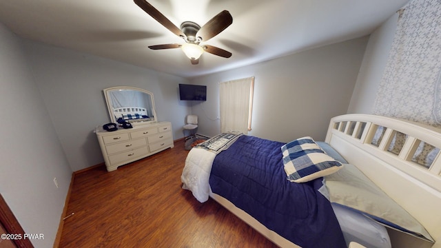 bedroom featuring ceiling fan and dark hardwood / wood-style flooring