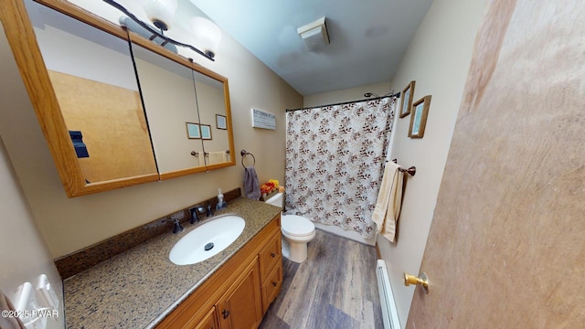 bathroom with a baseboard radiator, wood-type flooring, vanity, toilet, and a shower with curtain