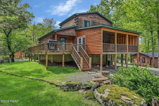 1007 Apache Ct, Lake Ariel, PA 18436 - rear view of house with stairway, a deck, a ceiling fan, central AC, and a lawn