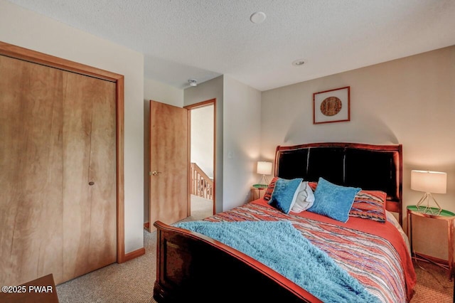 1007 Apache Ct, Lake Ariel, PA 18436 - bedroom with carpet, a closet, and a textured ceiling