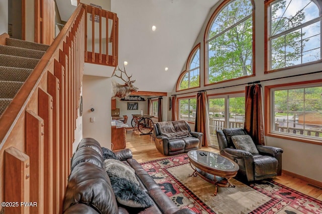 1007 Apache Ct, Lake Ariel, PA 18436 - living room featuring high vaulted ceiling, wood finished floors, recessed lighting, and stairway