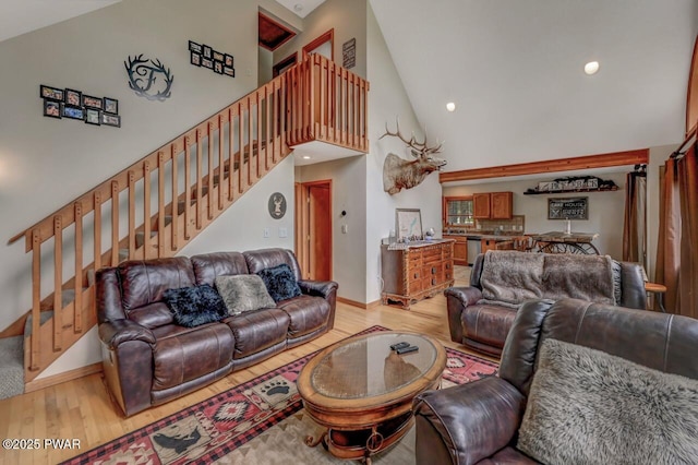 1007 Apache Ct, Lake Ariel, PA 18436 - living room with high vaulted ceiling, stairs, light wood finished floors, baseboards, and recessed lighting