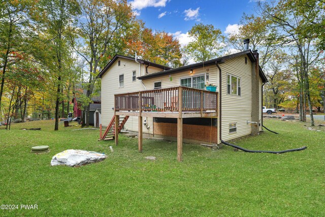161 Lakeview Dr, Dingmans Ferry, PA 18328 - rear view of house with a lawn and a deck