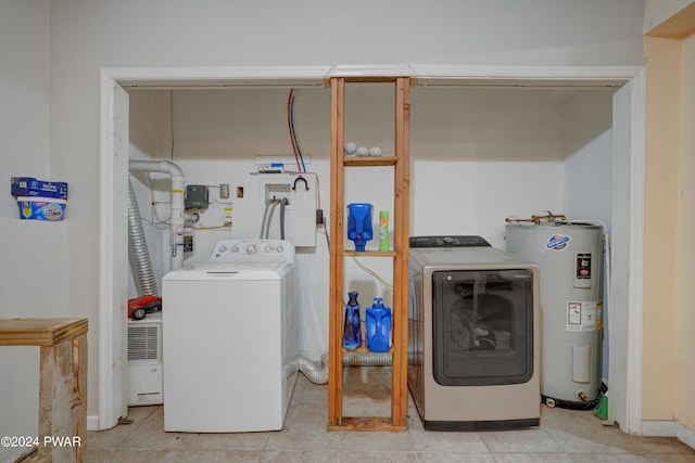 laundry area with washing machine and dryer and electric water heater