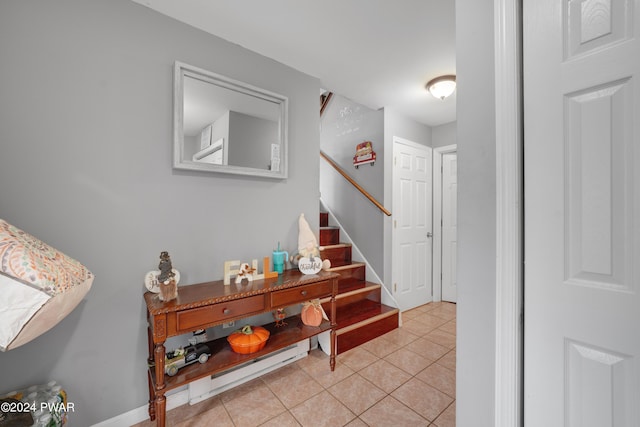 hall with light tile patterned flooring