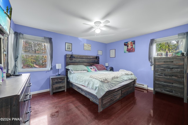 bedroom featuring baseboard heating, ceiling fan, and dark hardwood / wood-style floors