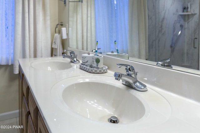 bathroom with vanity and tile patterned floors