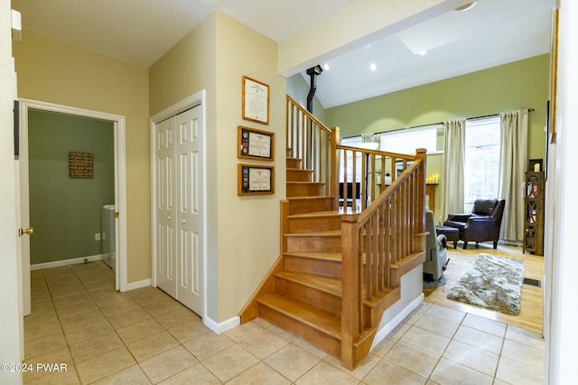 stairway with tile patterned flooring