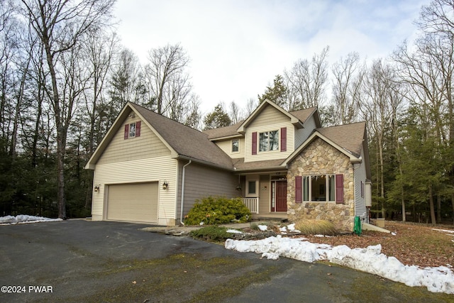 craftsman-style house with a porch and a garage