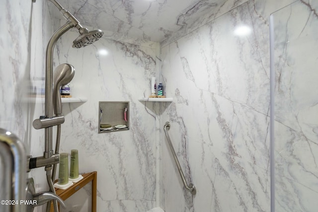 bathroom with tiled shower