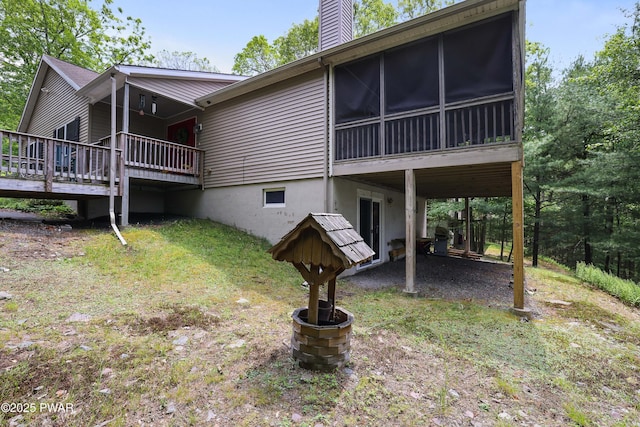 102 Circle Dr, Milford, PA 18337 - view of side of property with a chimney, a wooden deck, and a sunroom