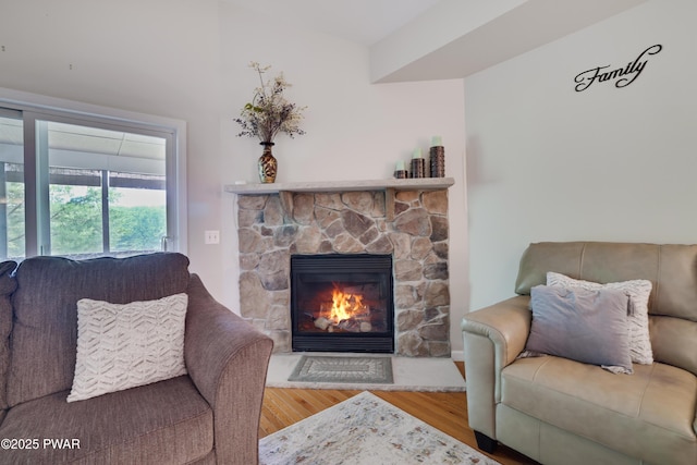 102 Circle Dr, Milford, PA 18337 - living area with wood finished floors and a stone fireplace