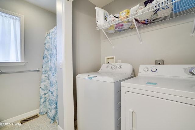 102 Circle Dr, Milford, PA 18337 - washroom with washer and dryer and light tile patterned floors