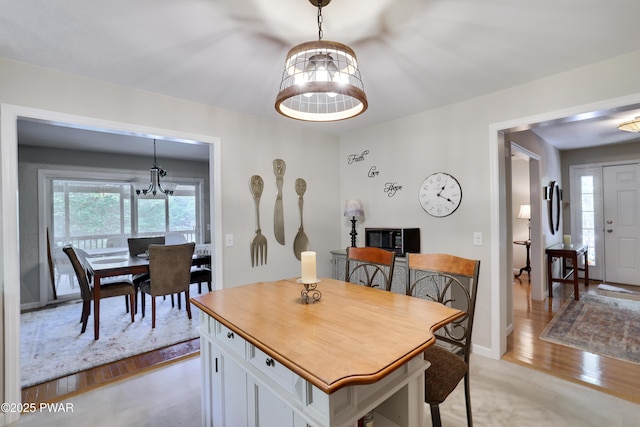 102 Circle Dr, Milford, PA 18337 - dining space with a chandelier and light wood-style flooring