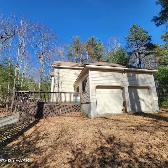 111 Ranger Rd, Greeley, PA 18425 - view of property exterior with an attached garage and a deck