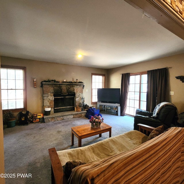 111 Ranger Rd, Greeley, PA 18425 - living room with a stone fireplace, carpet flooring, and plenty of natural light
