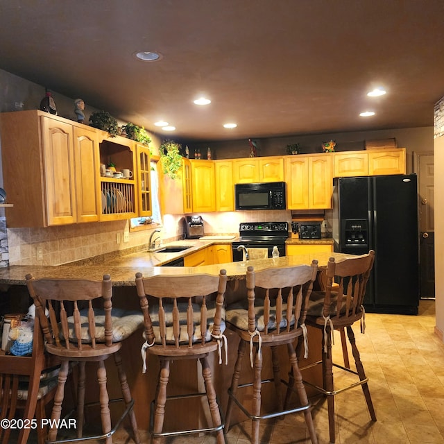 111 Ranger Rd, Greeley, PA 18425 - kitchen with black appliances, a sink, recessed lighting, a peninsula, and decorative backsplash