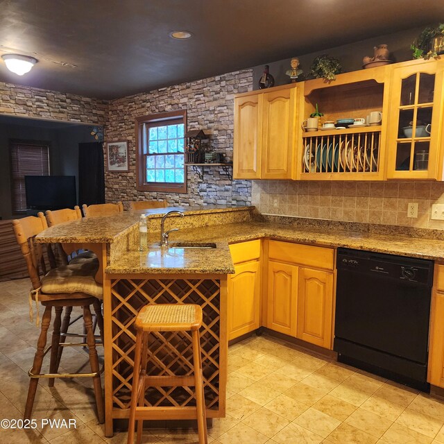 111 Ranger Rd, Greeley, PA 18425 - kitchen with a sink, open shelves, a breakfast bar area, light stone countertops, and dishwasher