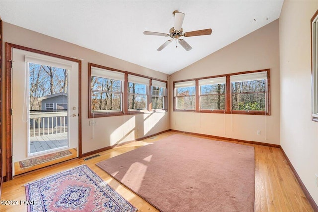 unfurnished sunroom featuring vaulted ceiling and ceiling fan