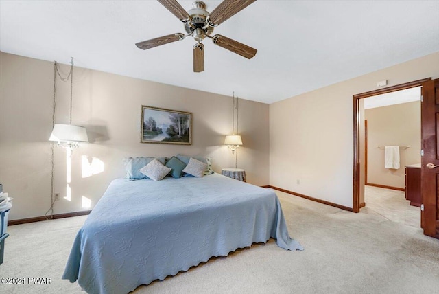 bedroom featuring ceiling fan and light colored carpet