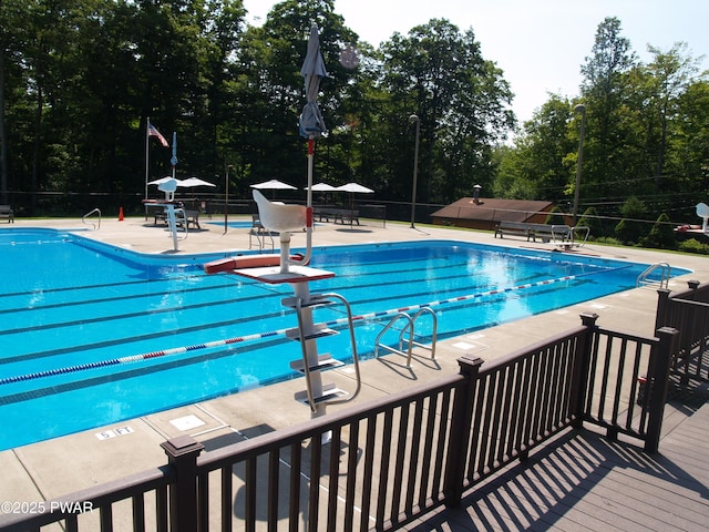 1032 Deer Field Ct, Lake Ariel, PA 18436 - community pool with a patio and view of wooded area