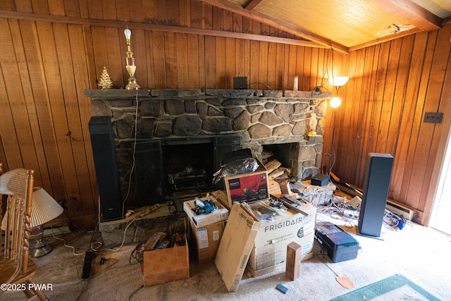 1032 Deer Field Ct, Lake Ariel, PA 18436 - carpeted living room featuring a fireplace, wood walls, and vaulted ceiling