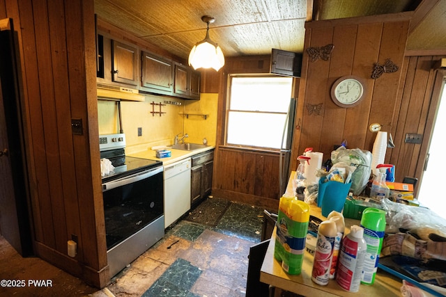 1032 Deer Field Ct, Lake Ariel, PA 18436 - kitchen with stainless steel electric stove, under cabinet range hood, dishwasher, wood walls, and light countertops