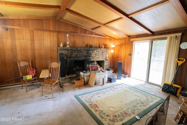 1032 Deer Field Ct, Lake Ariel, PA 18436 - living room featuring lofted ceiling, wood walls, and a stone fireplace