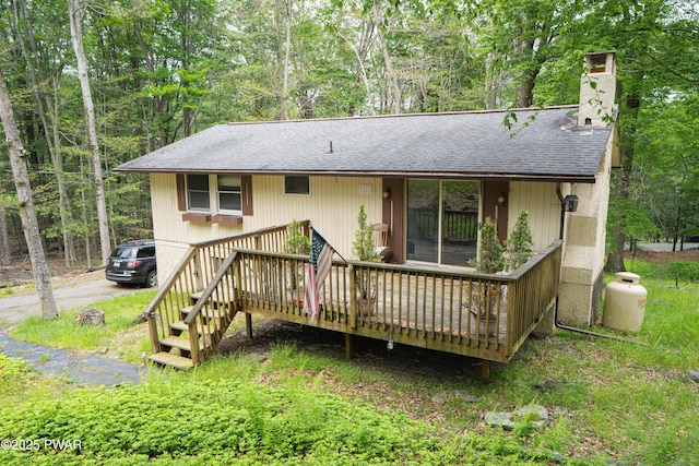 1032 Deer Field Ct, Lake Ariel, PA 18436 - back of house with roof with shingles, a chimney, and a wooden deck