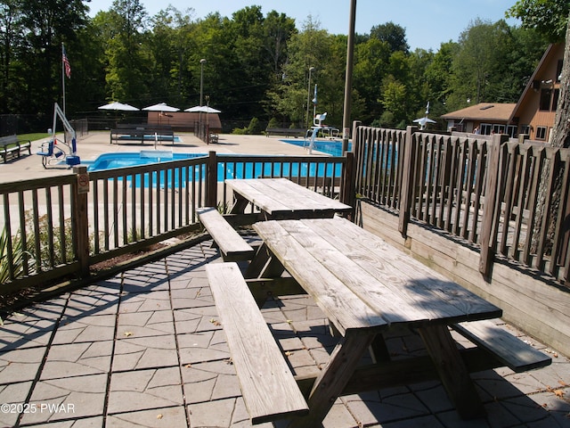 1032 Deer Field Ct, Lake Ariel, PA 18436 - community pool featuring a patio area, outdoor dining area, and a view of trees