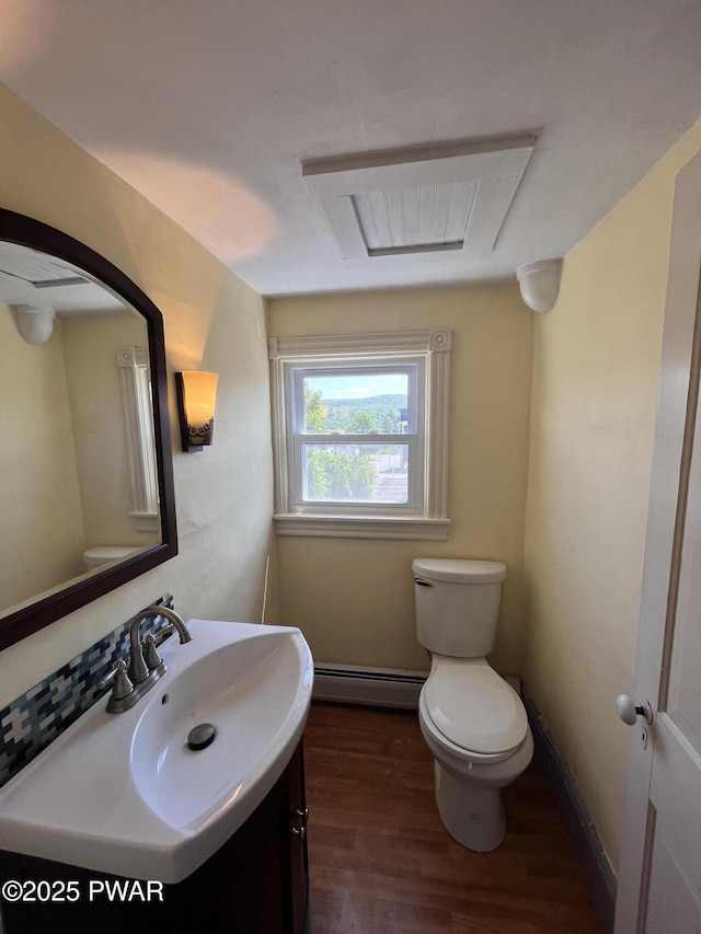 109 N St, Forest City, PA 18421 - bathroom featuring vanity, wood finished floors, and baseboard heating