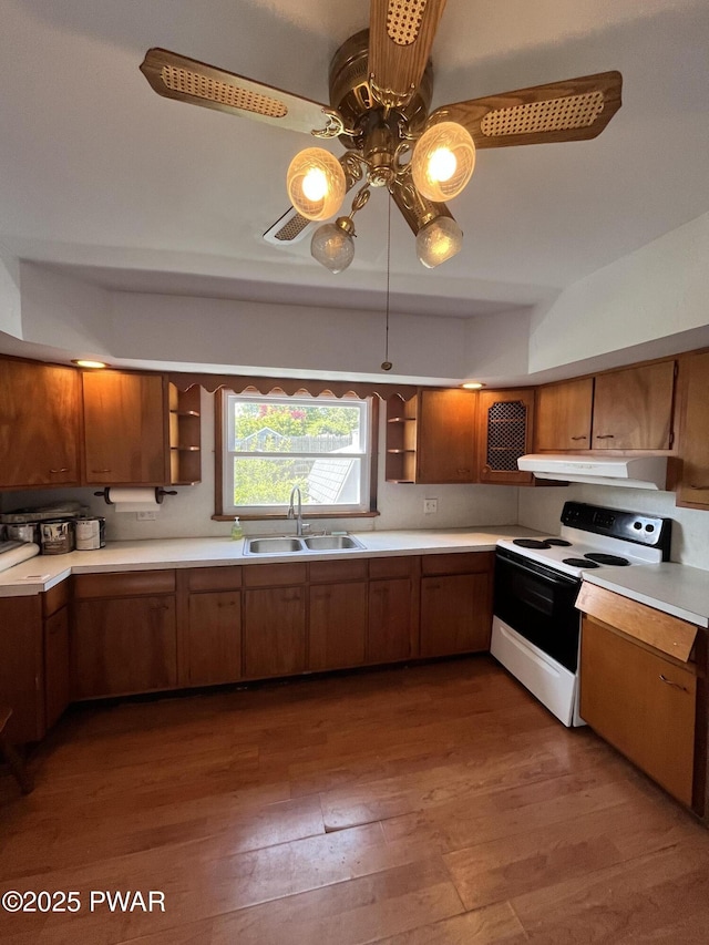 109 N St, Forest City, PA 18421 - kitchen with white electric range, open shelves, a ceiling fan, wood-type flooring, and under cabinet range hood