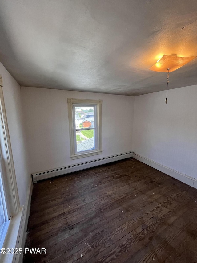 109 N St, Forest City, PA 18421 - spare room with a baseboard heating unit and wood finished floors