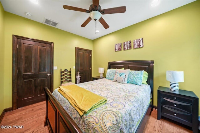 bedroom featuring ceiling fan and light hardwood / wood-style floors