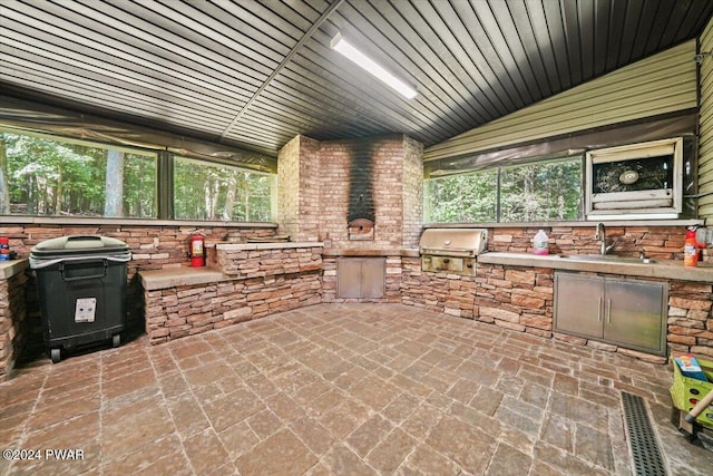 view of patio / terrace featuring area for grilling and sink