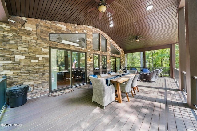 sunroom / solarium featuring ceiling fan, wood ceiling, and vaulted ceiling